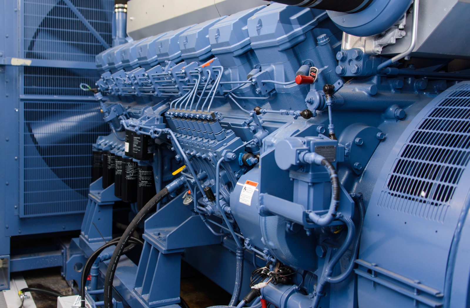 A blue industrial diesel generator powers a business's operations.