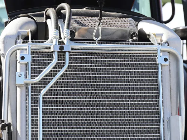 Radiator repair showcased with a metallic radiator and its intricate tubes and connectors