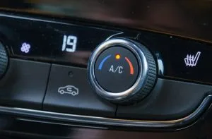 A temperature control knob displays the number 19 and shows A/C settings